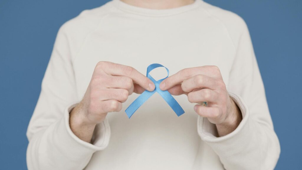 person holding blue ribbon